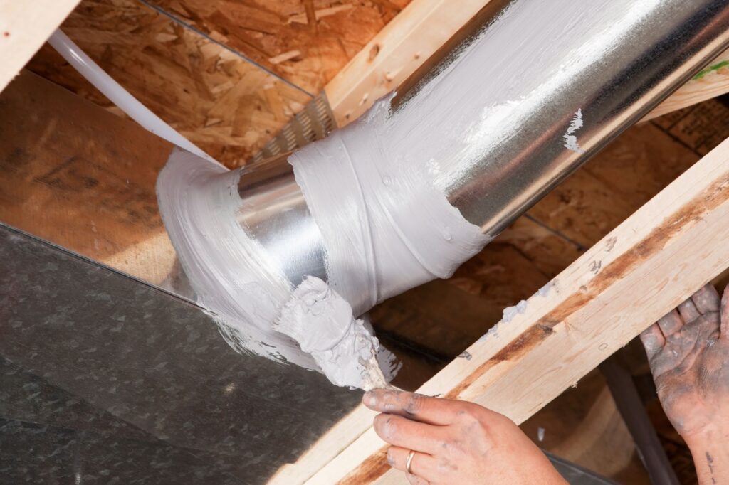 Closeup of residential ductwork sealing