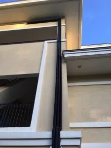 drainage system running up building
