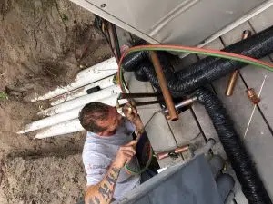 Birdseye view of contractor working on pipes